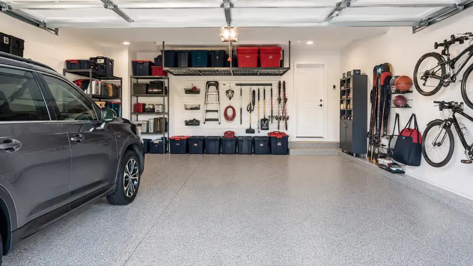 Illustration of a clean, organized garage with storage along the walls and room for a vehicle